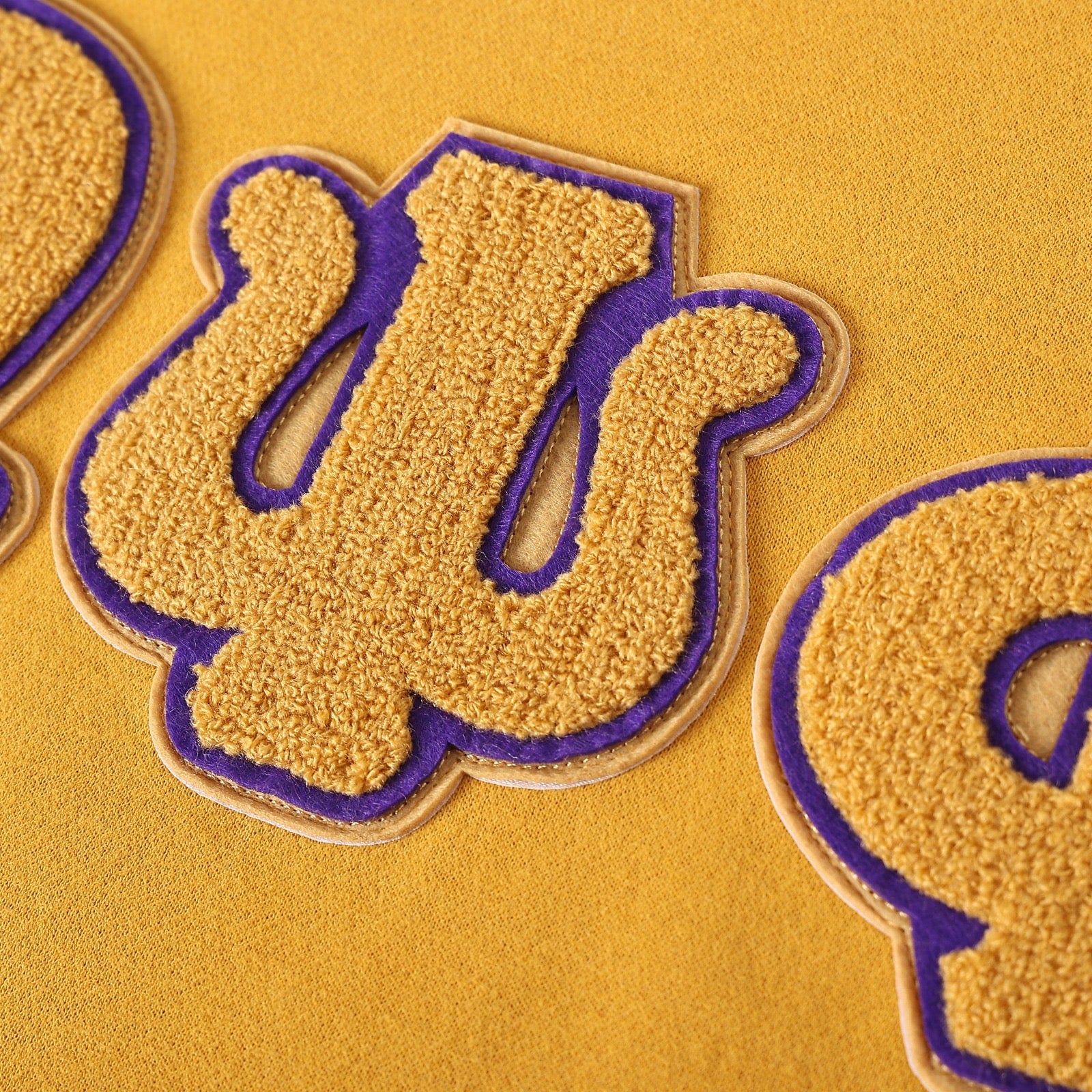 Omega Gold Letter Chenille Crewneck