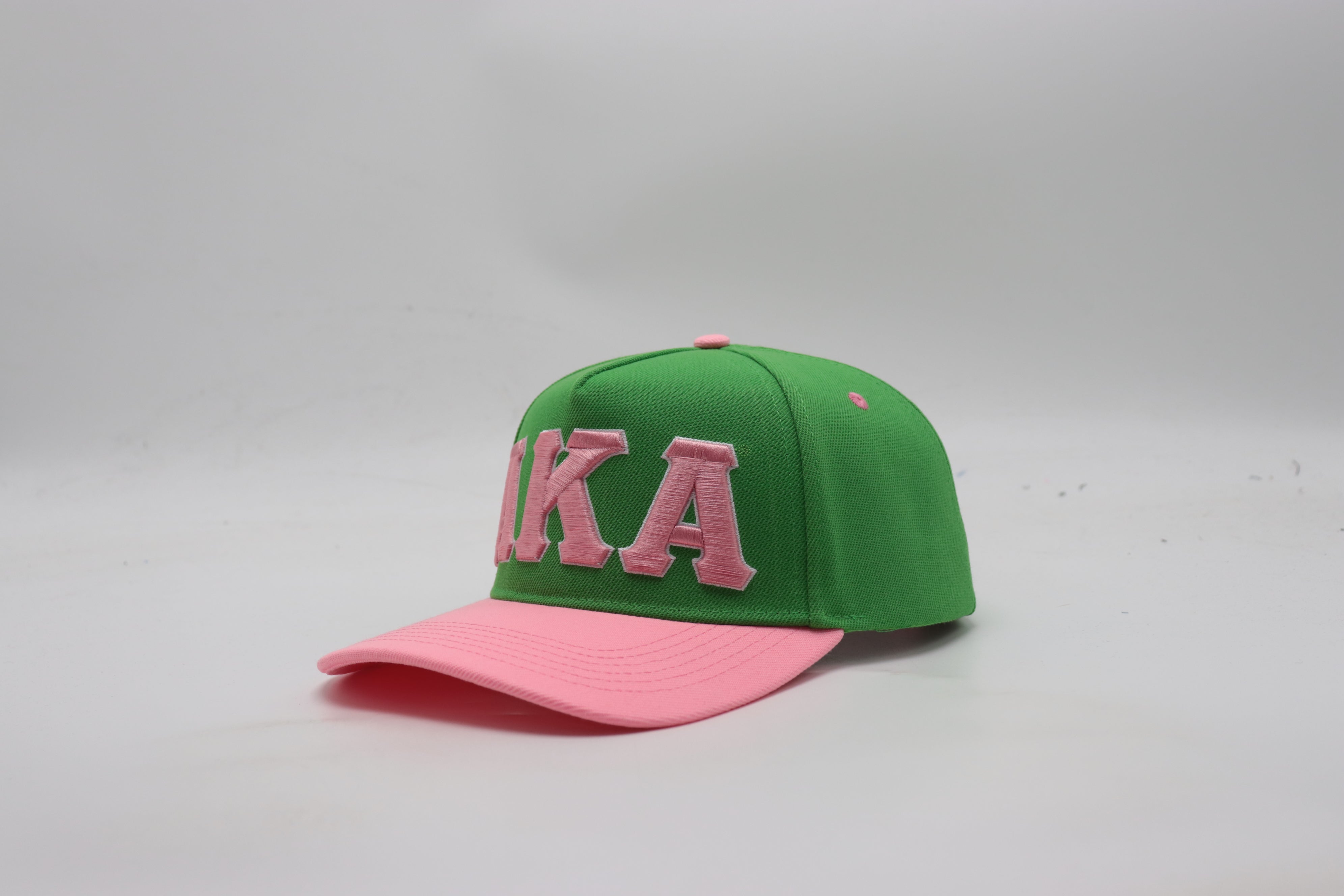 AKA Green Letters Snapback Hat