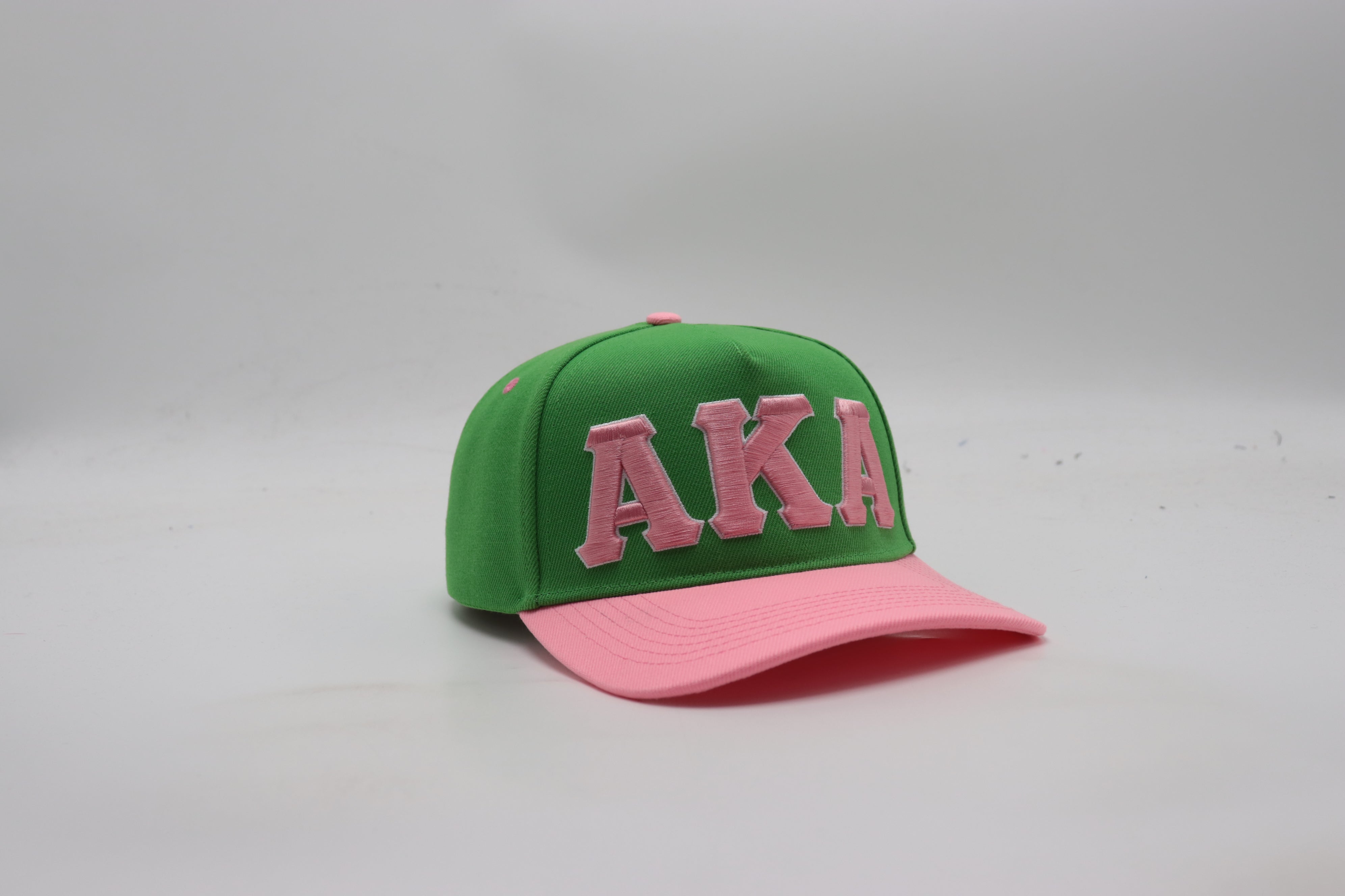 AKA Green Letters Snapback Hat