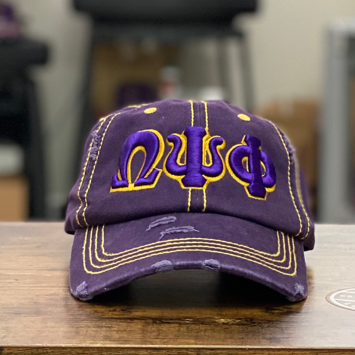 “ΩΨΦ” Omega Purple & Old Gold Stitch Distressed Hat