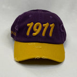 “1911” Omega Psi Phi Purple & Old Gold distressed hat