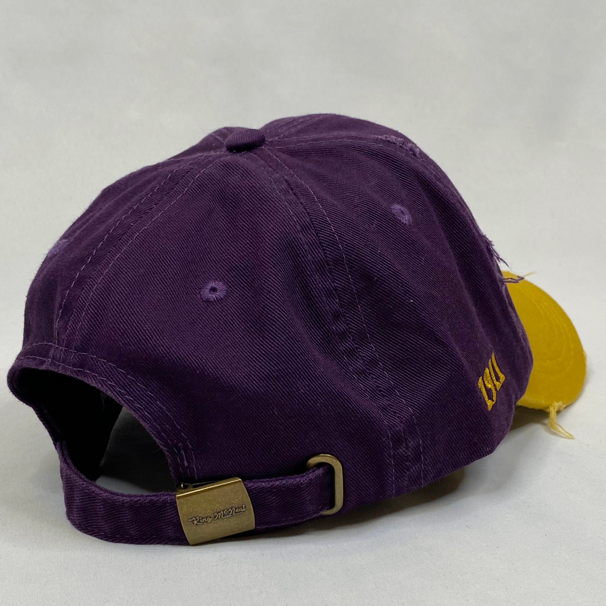 “Ω” Omega Psi Phi Purple & Old Gold distressed hat