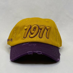 Gold 1911 dad hat purple bib