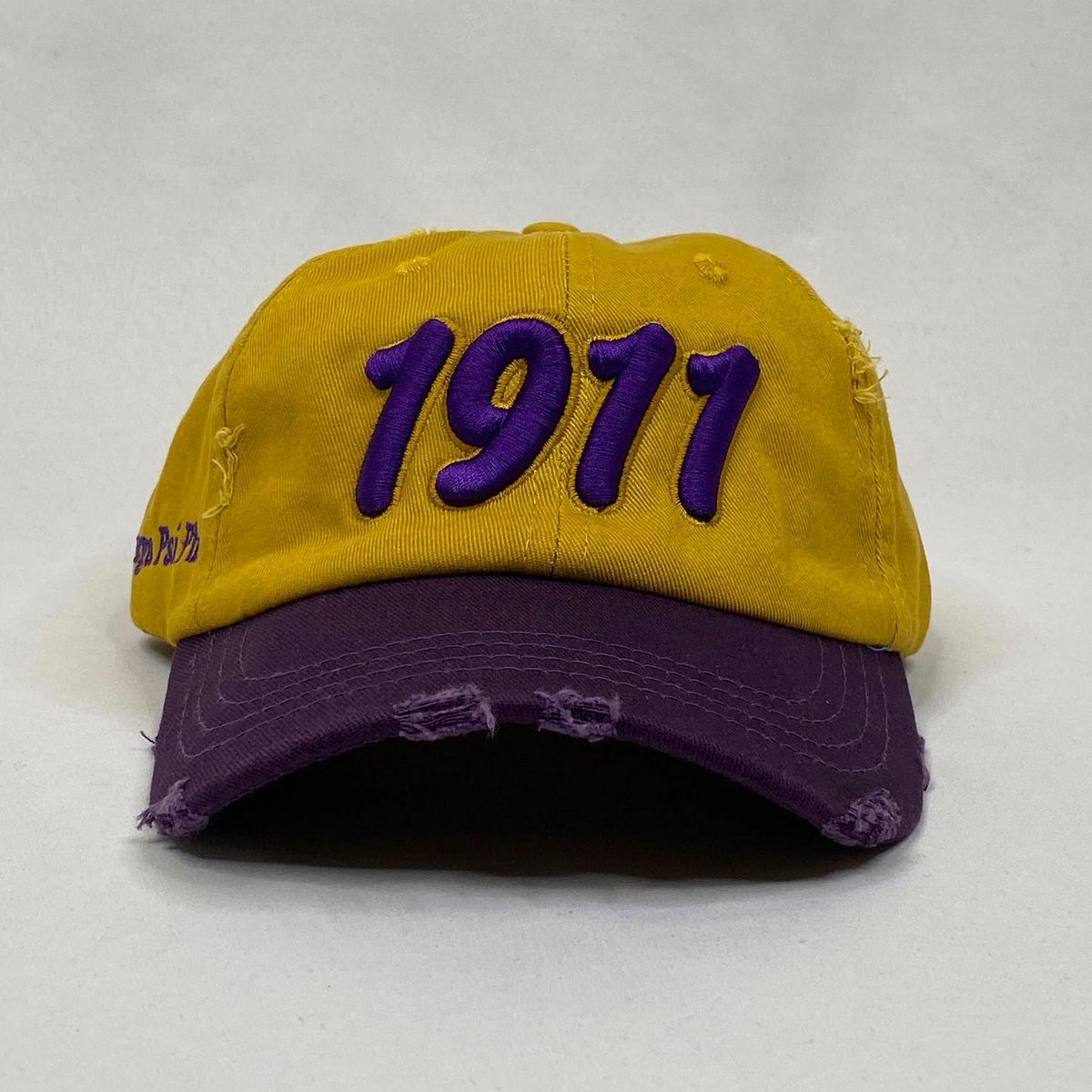 Gold 1911 dad hat purple bib